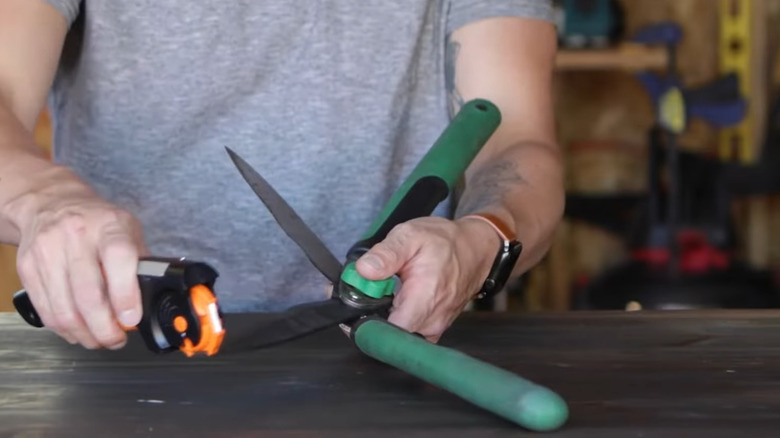 hold garden shears open while you use a single-bevel sharpener to sharpen them