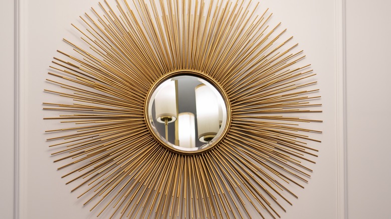 An Art Deco-style mirror with gold lines