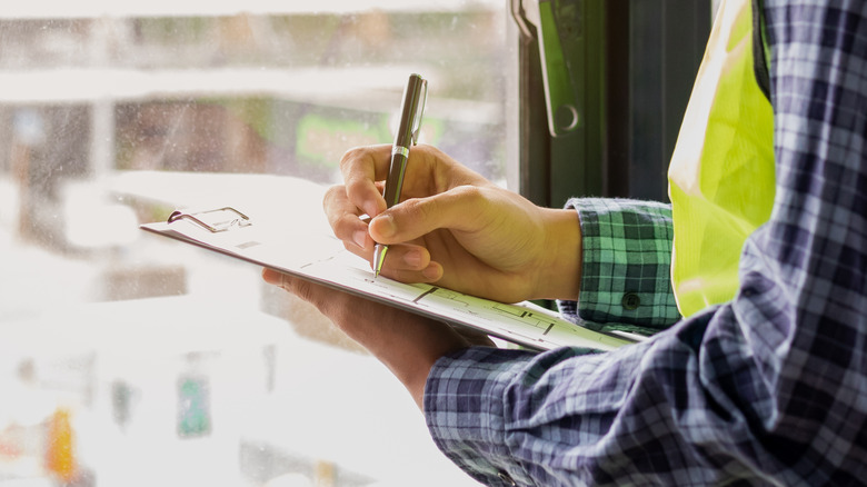 Home inspector making notes