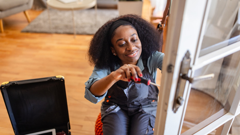 Woman using a manual screwdriver