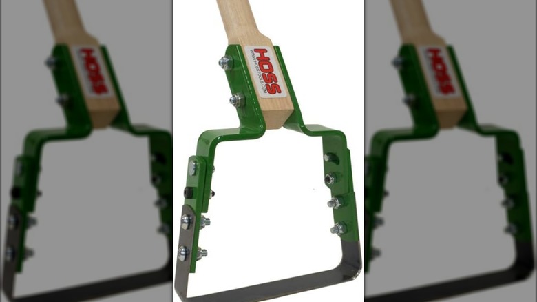 The green metal blade of a Hoss stirrup hoe.