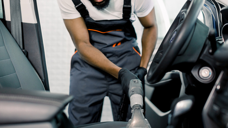 car seat being vacuumed