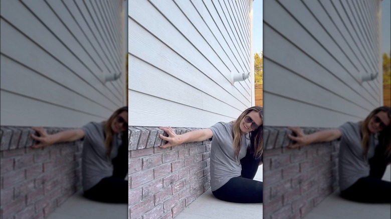 installing brick veneer outside a home