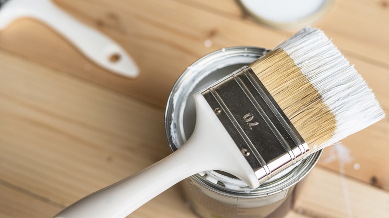 Paint brush with white paint