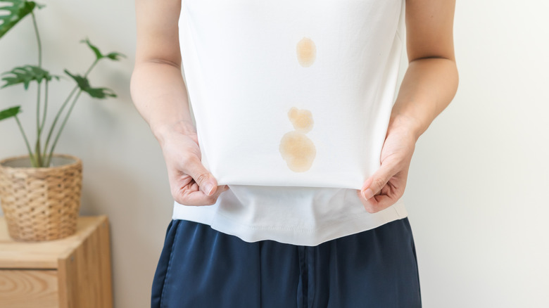 A white shirt with grease stains on it