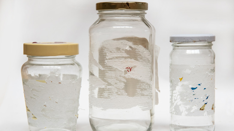 Sticky labels peeled off glass jars
