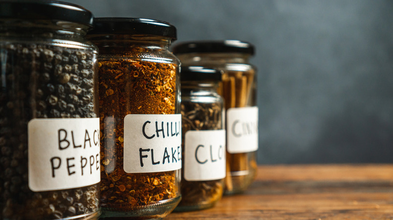 Kitchen spices in repurposed glass jars