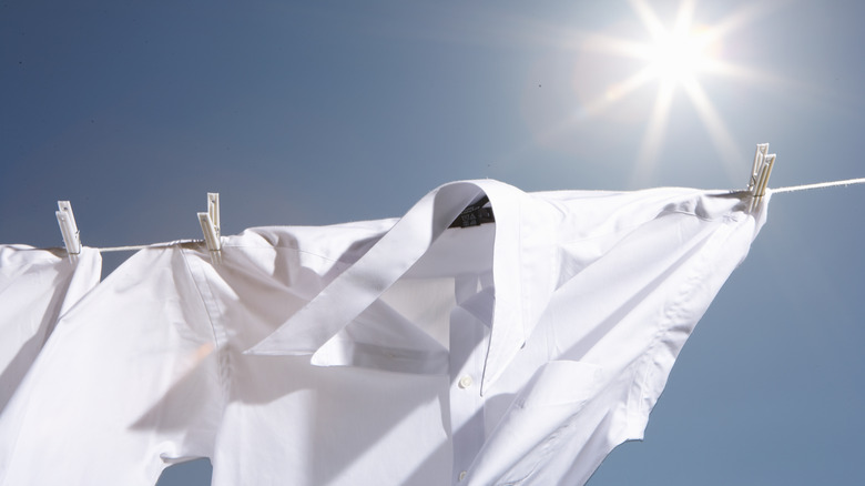 White shirts hanging on clothesline 