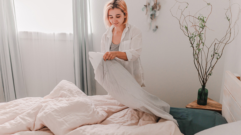 Woman holding pillow 