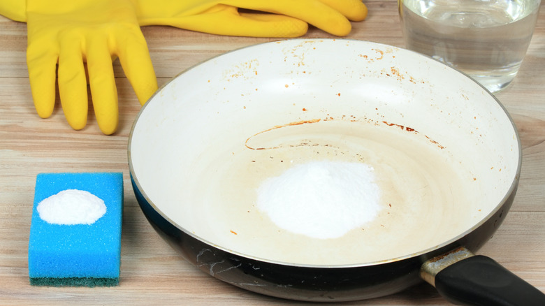 Dirty pan and sponge with baking soda