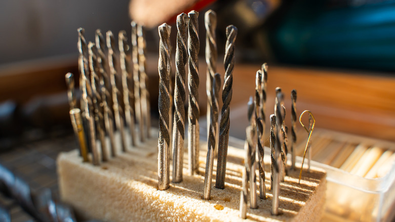 A collection of woodworking drill bits ready to be sharpened