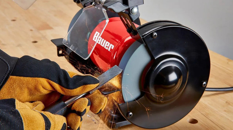 Sharpening a chisel on a Bauer 6-inch grinder