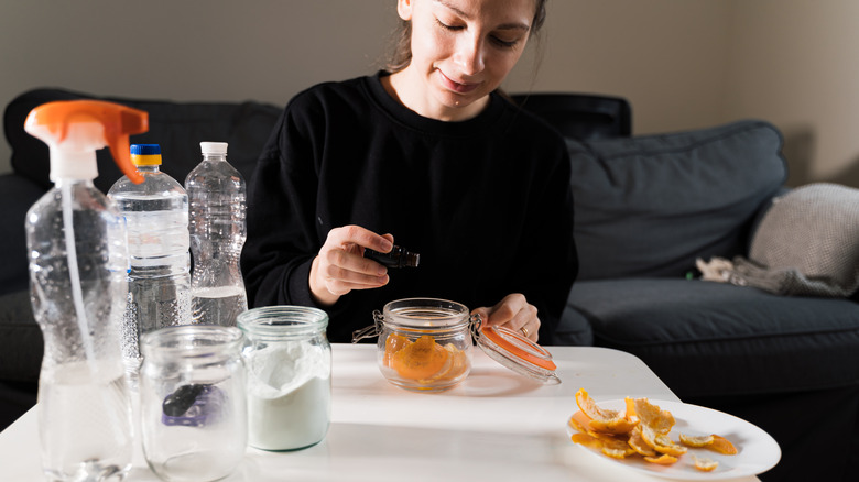 Woman DIYing lemon-based cleaner