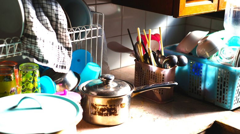 Messy countertop in a kitchen with not enough storage