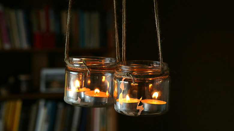 hanging glass jars with tea light candles