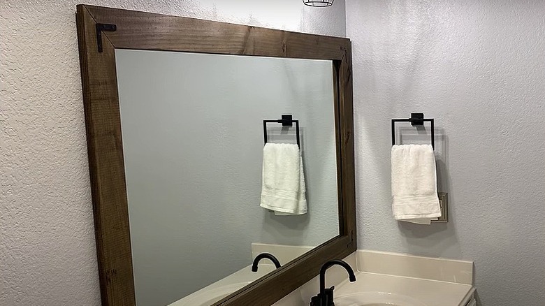 Wooden mirror frame with brackets