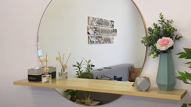 Floating shelf on round mirror