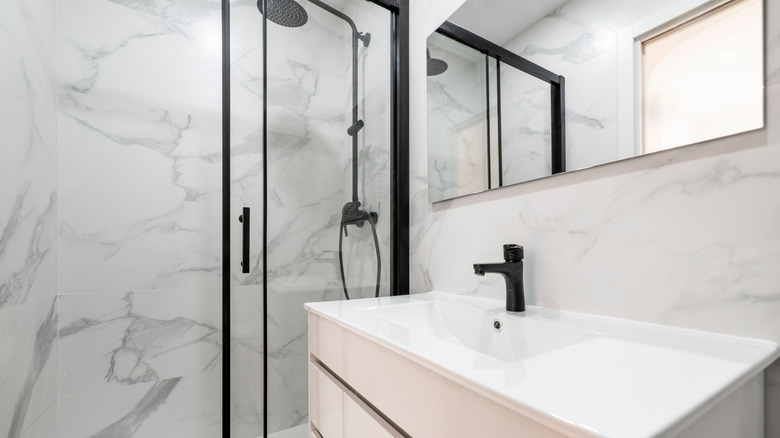 Frameless mirror in bathroom