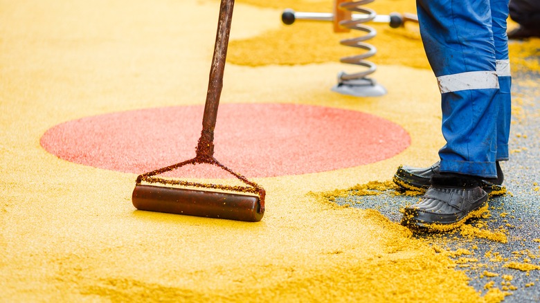 person coating playground