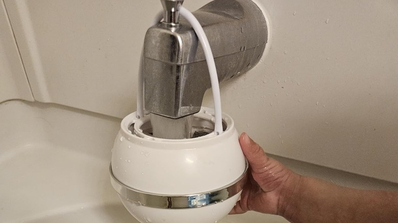 A bath ball filter on a faucet
