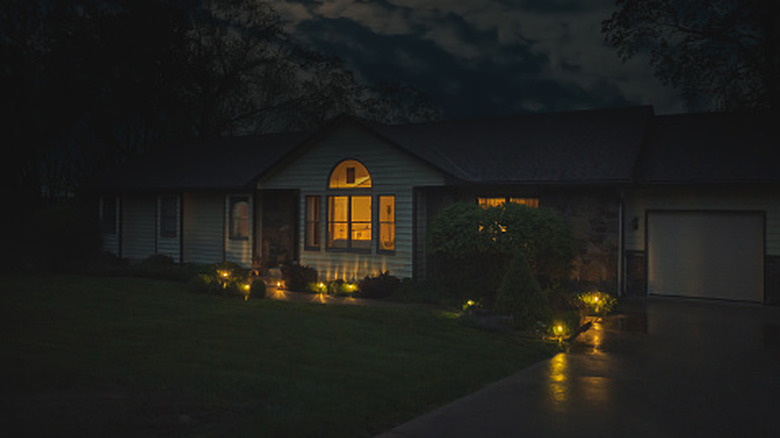 shot of suburb house with night lights