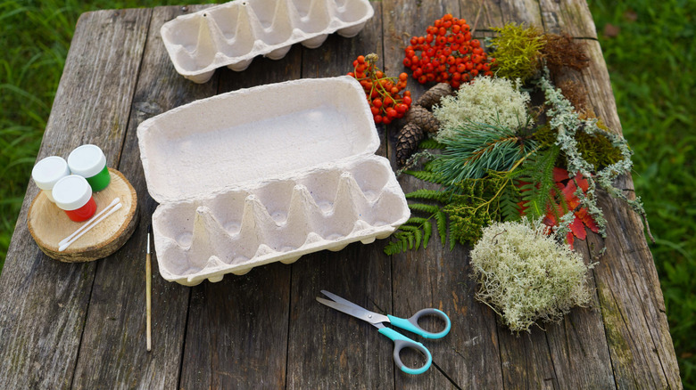 Table full of supplies for an egg carton craft