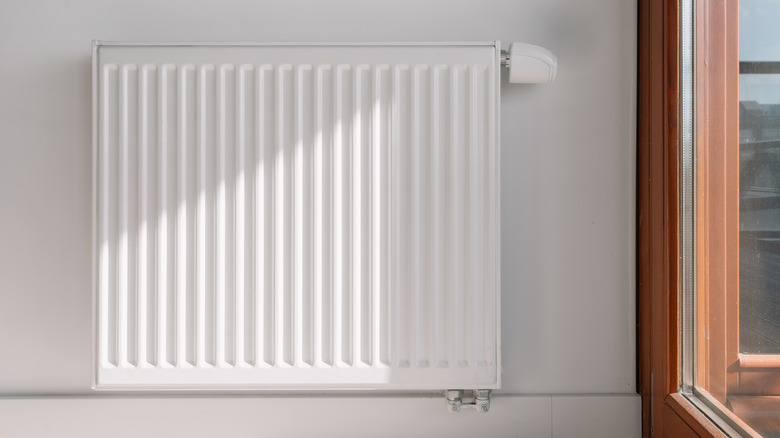 A radiator near a glass door