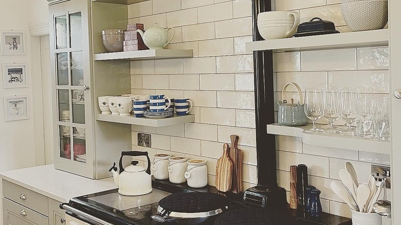 Kitchen with open shelving on the walls