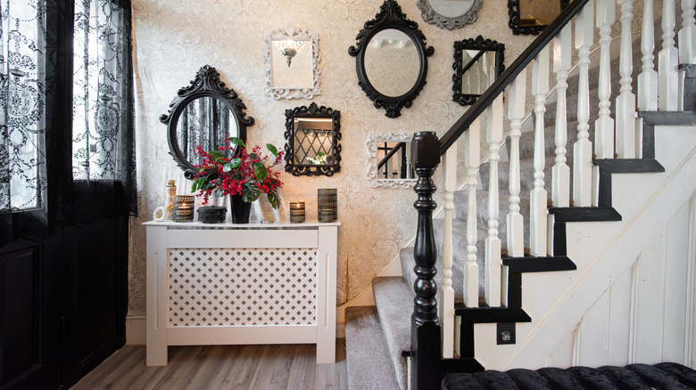 Vintage mirrors leading up a staircase