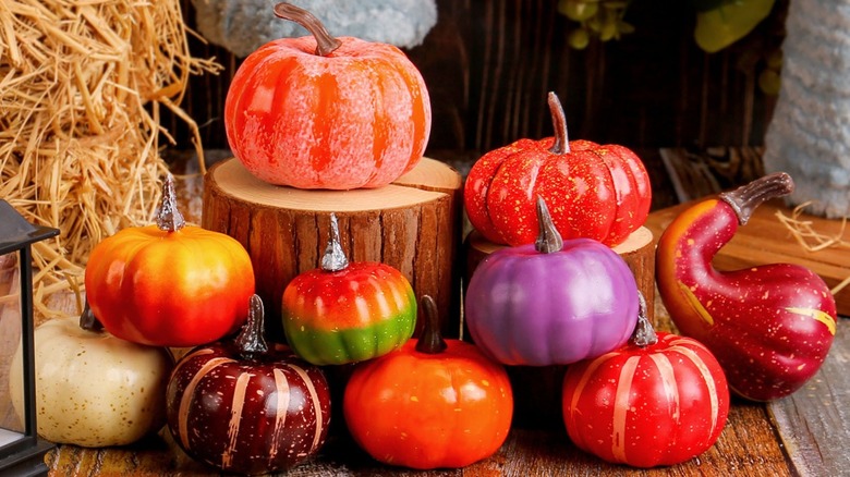 A display of colorful plastic pumpkins