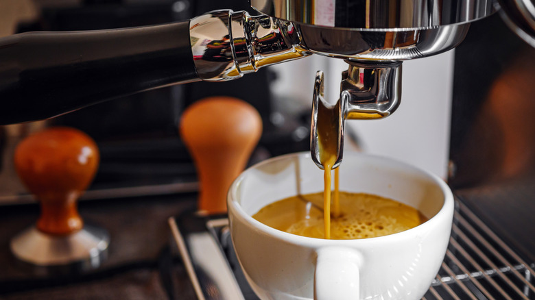 Close-up image of an espresso machine making espresso