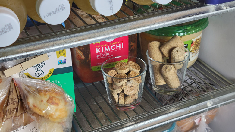 Whole and sliced cork on a refrigerator shelf