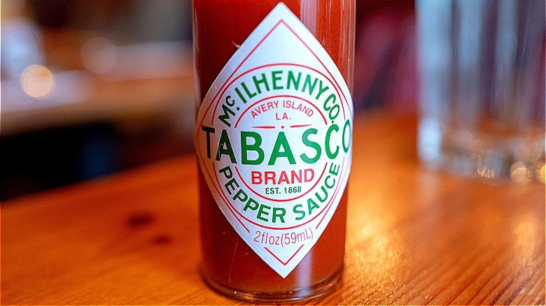 tabasco bottle on wooden table