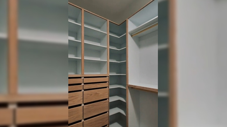 A space-saving corner shoe rack in a closet storage unit
