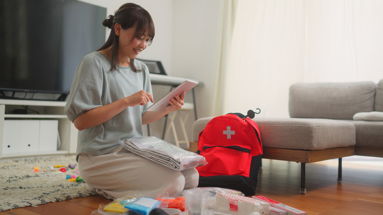 Woman checking emergency plan