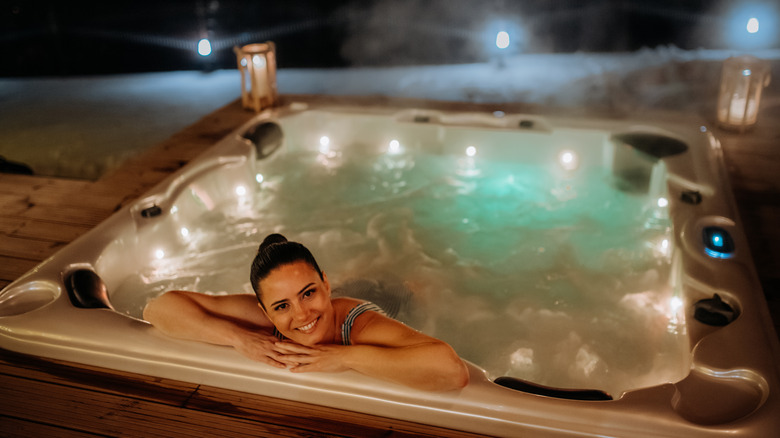 Women enjoying hot tub at night