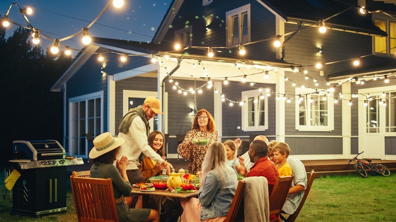 Family dinner outside at night