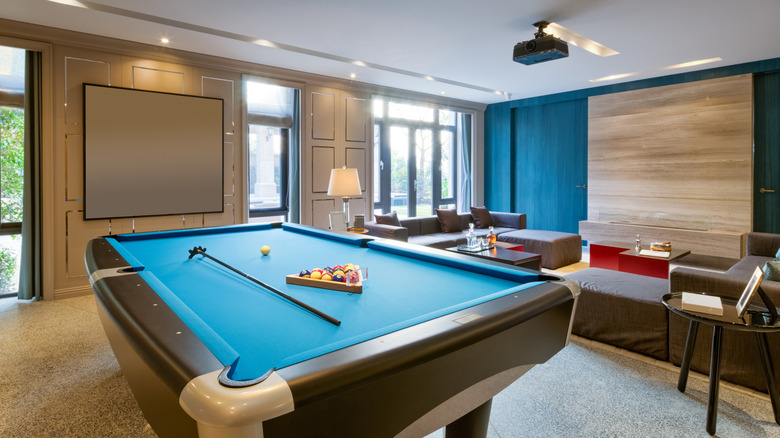 Billiards and lounge area in an entertainment room