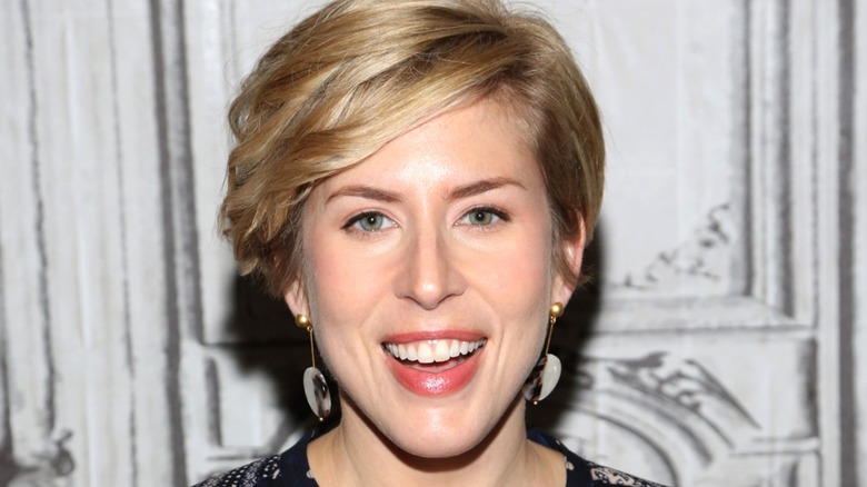 Erin Napier smiling broadly on red carpet at event