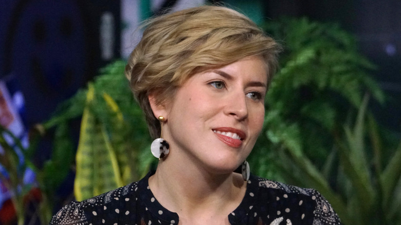 Erin Napier smiling and looking to the side