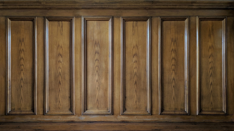 Old classic wall with vintage brown beech wood panels