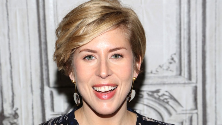 Erin Napier smiling broadly on red carpet at event