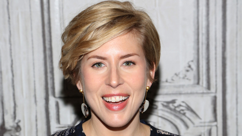 A close up on Erin Napier laughing.