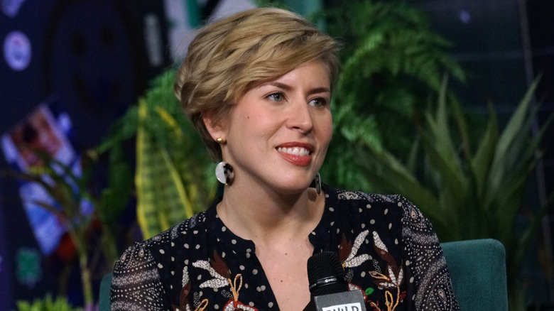 Erin Napier smiling in an embroidered top