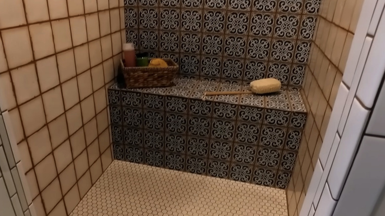 A shower with Moroccan patterned tiles