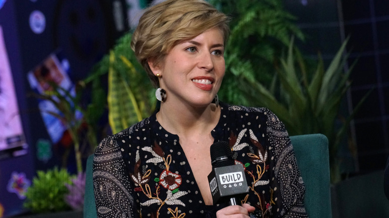 Erin Napier holding a microphone during interview