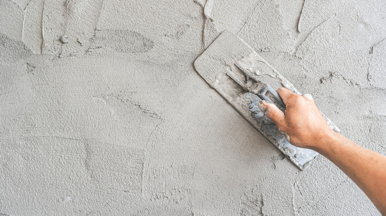 Applying plaster to a wall