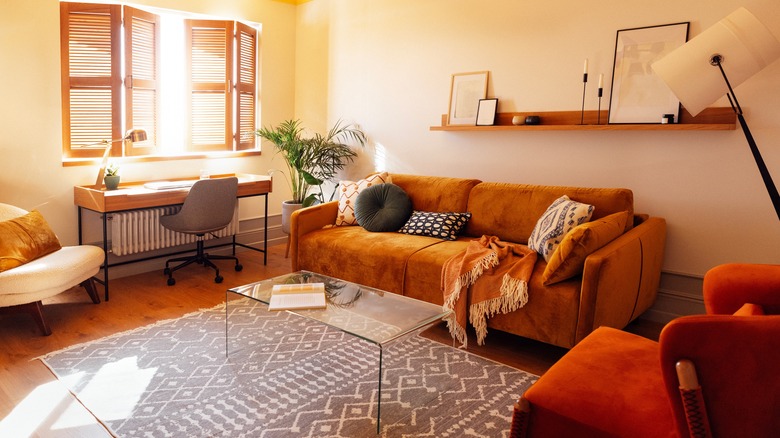 A warm and cozy living room featuring many different textures.
