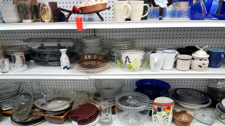 Thrift shop with shelves of kitchenware