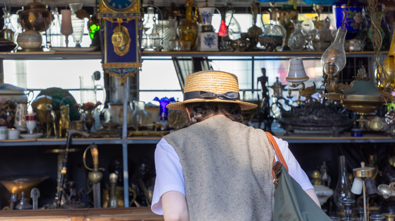 young woman solo antique shopping